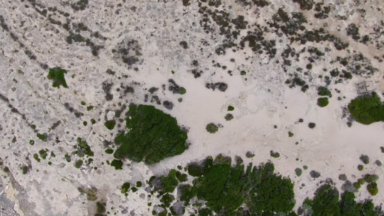The mountain terrain of Crete Island in Greece seen from directly above, Aerial drone top view lowering shot