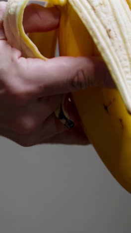 hand peeling a banana