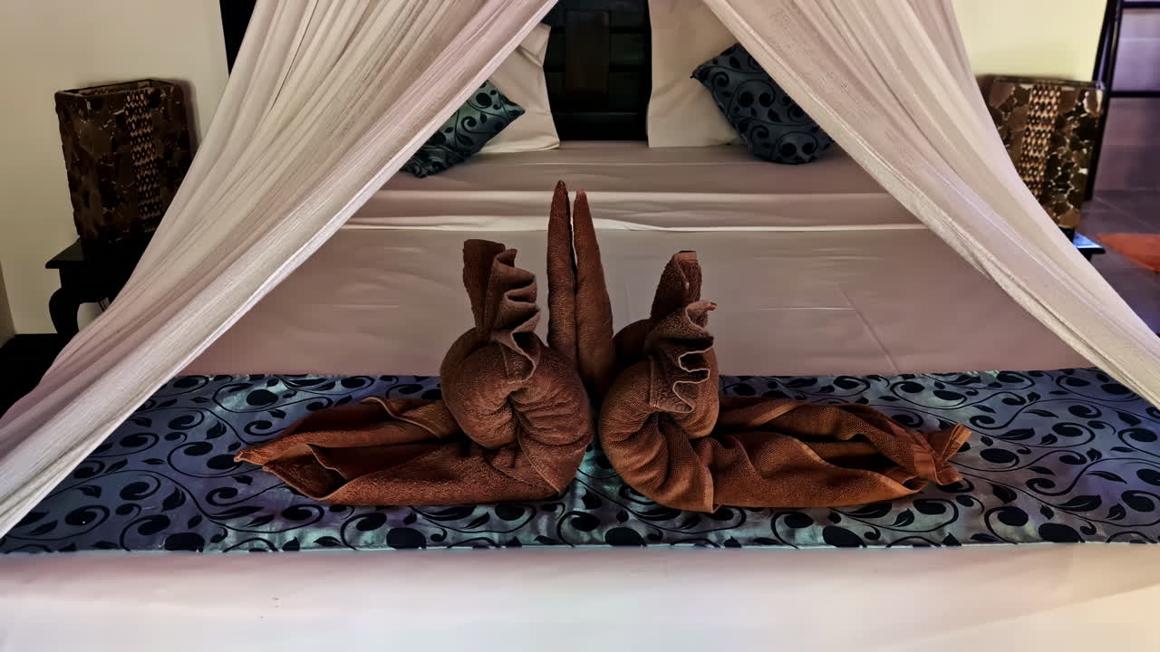 Closeup footage of towel animals crafted from brown colored towels