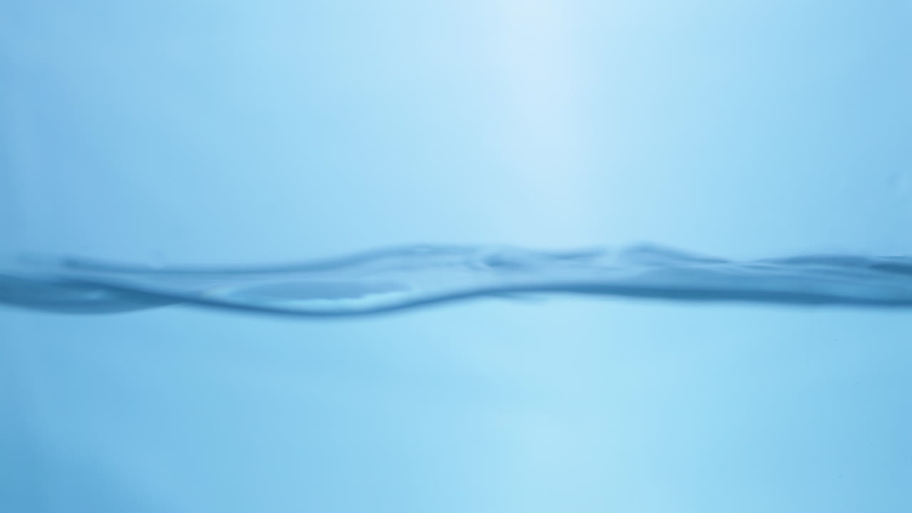 Captivating close-up of gentle waves, showcasing the clear and refreshing characteristics of drinking water.