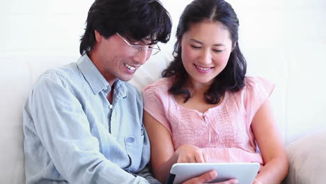 a couple using a tablet computer together