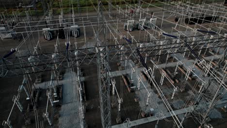 high voltage substation with pylons and distribution cables