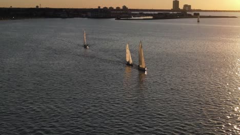 sailboats at sunset