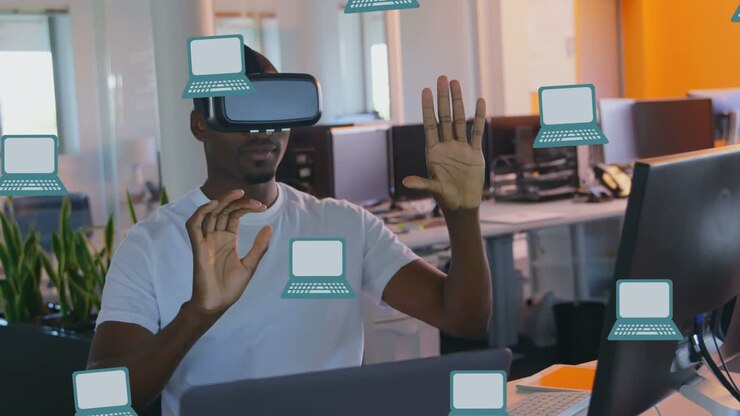 Multiple laptop icons in seamless pattern against african american man wearing vr headset at office