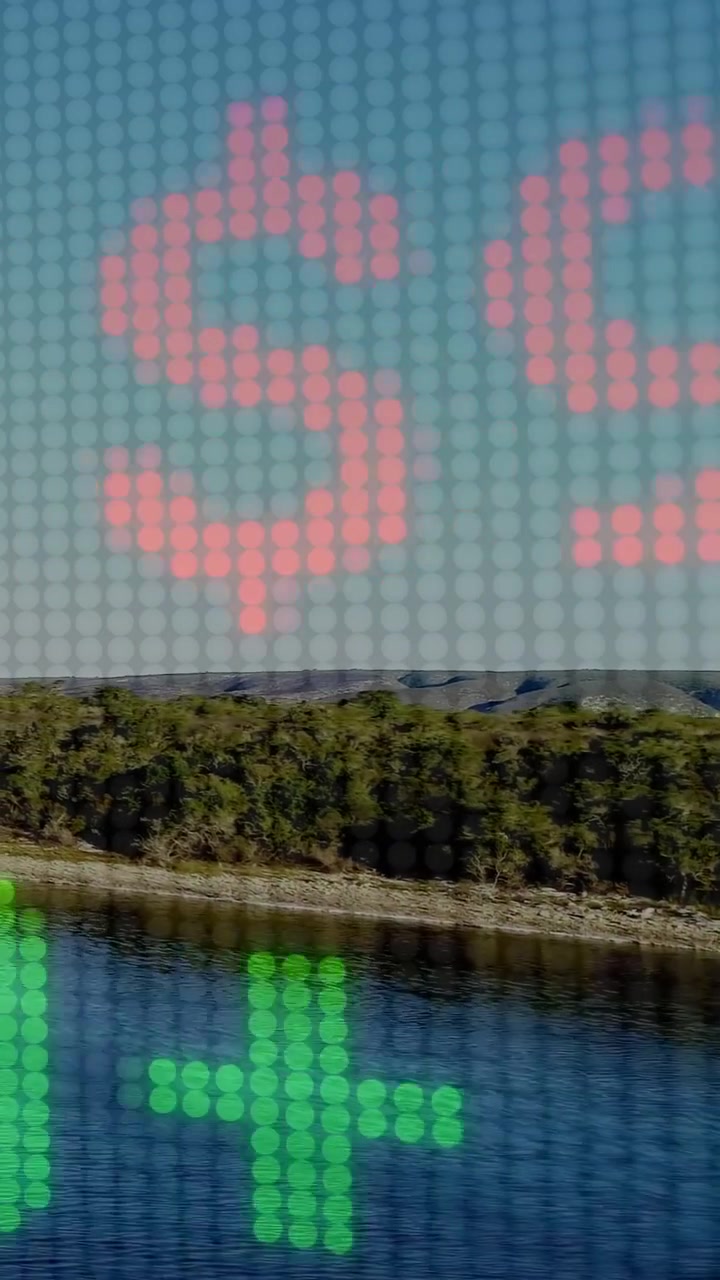 Vertikal video: LED-overlay på et rødt plus, der dukker op, rullende røde eller grønne tal, der viser floddata.