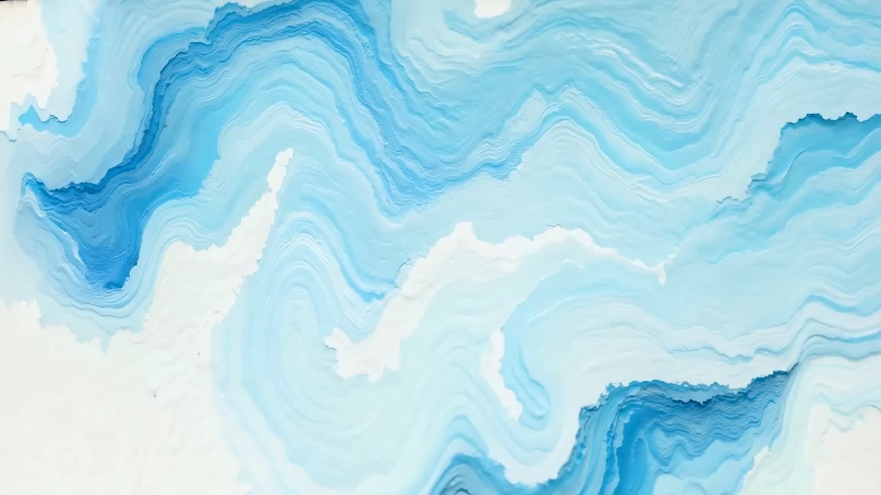 Abstract video with a top-down angle showcasing fluid, wavy blue and white patterns