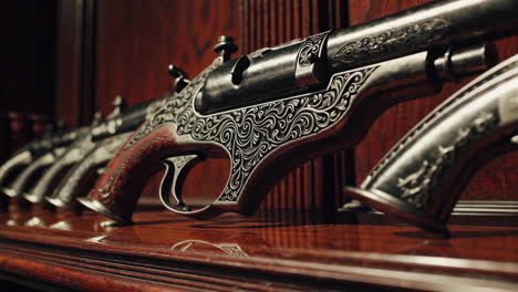ornate antique pistols displayed on wooden shelf