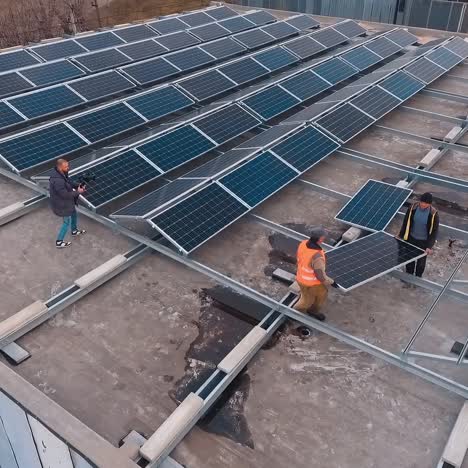 drone flight over solar cell panels. aerial footage of solar energy modules on rooftop