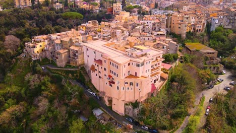 Drone-shot-ascending-over-the-town-of-Tivoli,-Italy-while-panning-down