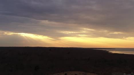 An-aerial-view-over-Montauk,-NY-during-a-golden-sunset