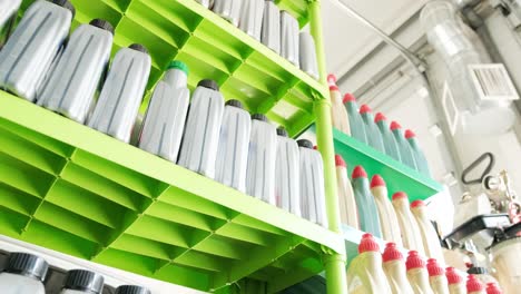 organized oil bottles on shelves in a workshop