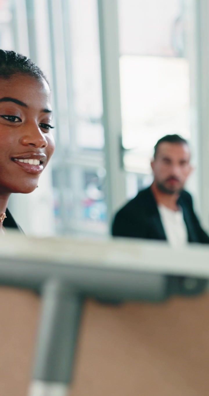 Young Professional Woman Leading a Business Meeting in an Office