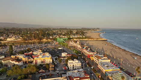 santa cruz california aerial v8 flyover beach boardwalk amusement park on a long stretch of sandy beach with san lorenzo river meets the sea at sunset in summer - shot with mavic 3 cine - may 2022