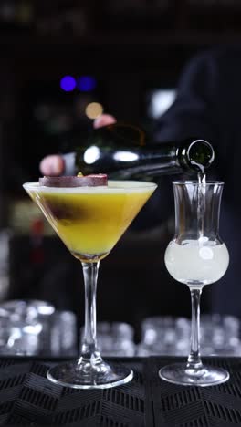 bartender pouring a cocktail