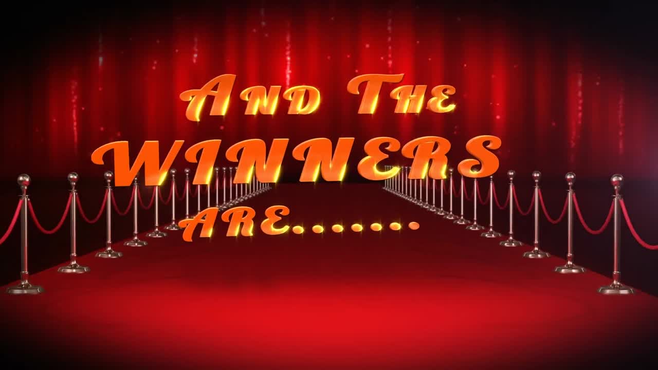 la animación de y los ganadores son texto con fuegos artificiales púrpura sobre la alfombra roja lugar
