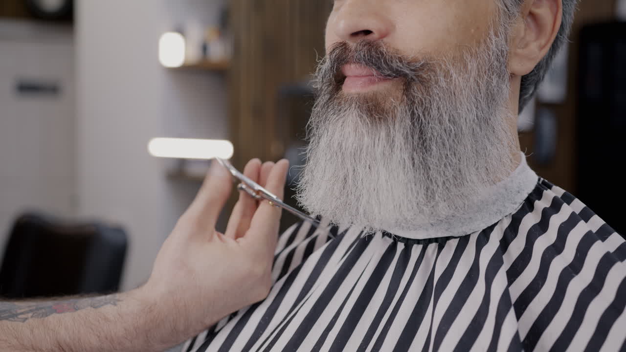 Man getting a beard trim at the barber shop