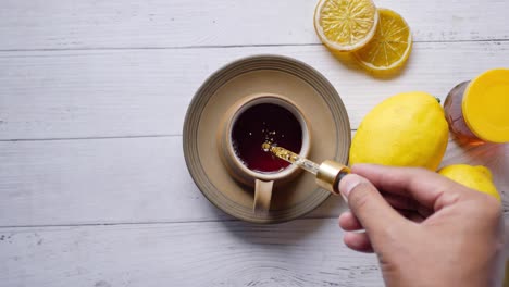 putting eucalyptus essential oils in cup of tea