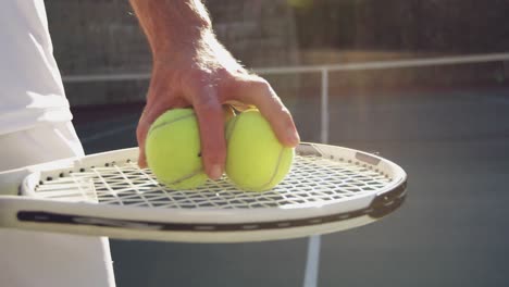 man playing tennis on a sunny day