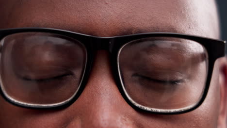 closeup, eyes and man with glasses