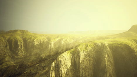 vast landscape illuminated by golden sunlight over rolling hills in nature