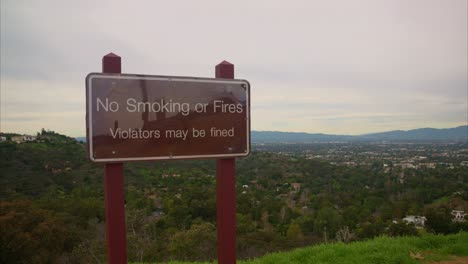 no smoking sign with los angeles in the back ground