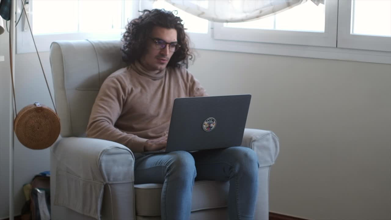 The Modern Workday: A Young Man's Productive Day from the Sofa