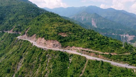 road going through himalayan mountain range in india