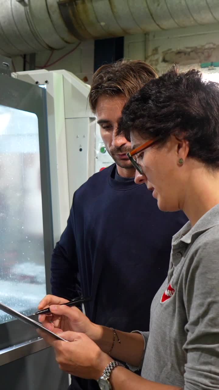 People working with CNC machine