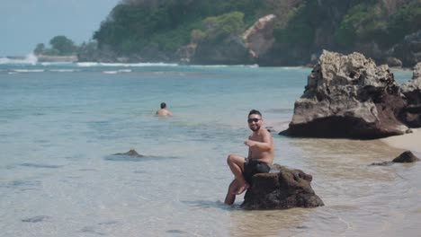 man relaxing on a tropical beach