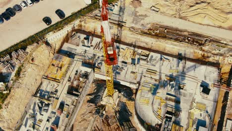 aerial flight over a new constructions development site with high tower cranes building real estate