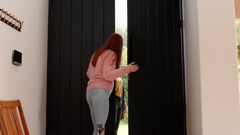 opening large black doors, woman with prosthetic leg entering room, copy space