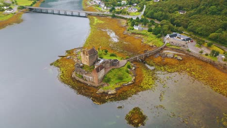 Aerial-Drone-Shot-Orbiting-Eilean-Donan-Castle-on-Scottish-Loch,-Scotland-Video