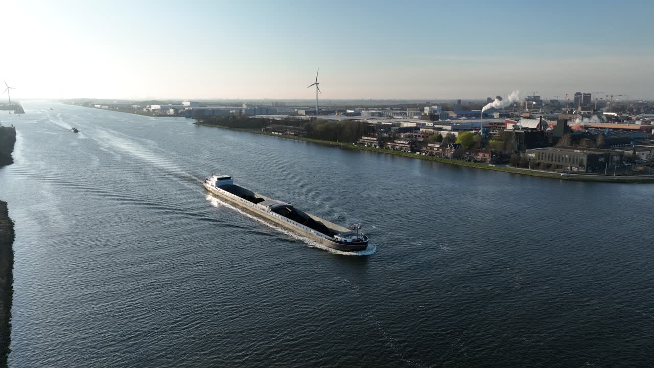 inland shipping vessel, on the Amsterdam rhine canal. Raw and bulk materials. Aerial view