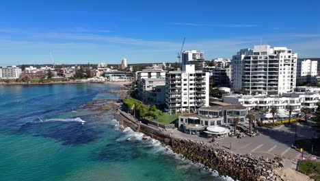 aerial coastal orbit establishing of cronulla city with beach, skyline and turquoise water, sydney nsw australia