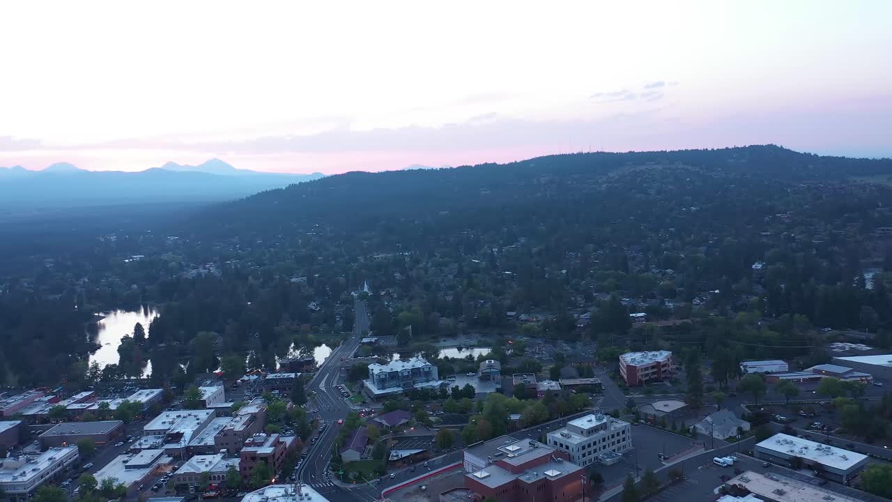 Orbiting drone flight above Bend Oregon, USA at dusk.
