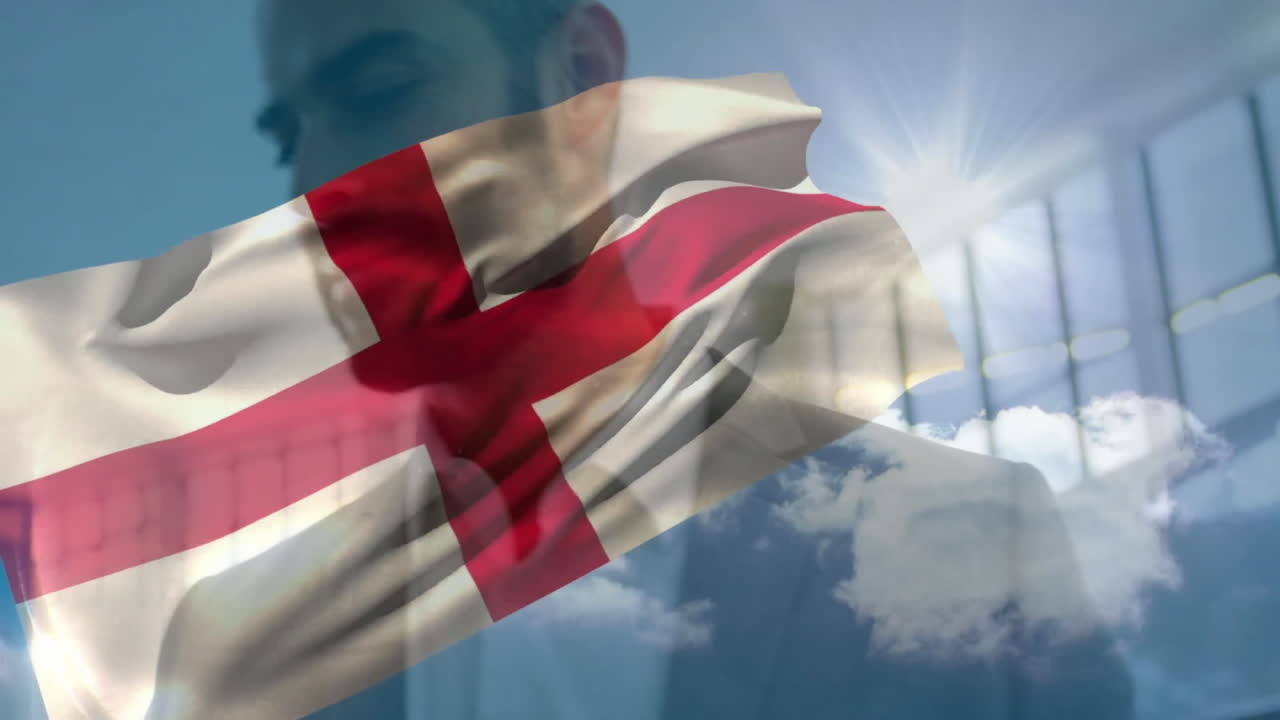 In bright sunlight, man with England flag overlay in animated background