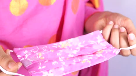 woman making or preparing a fabric mask