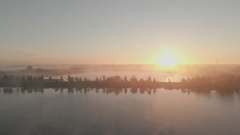 misty sunrise over a lake