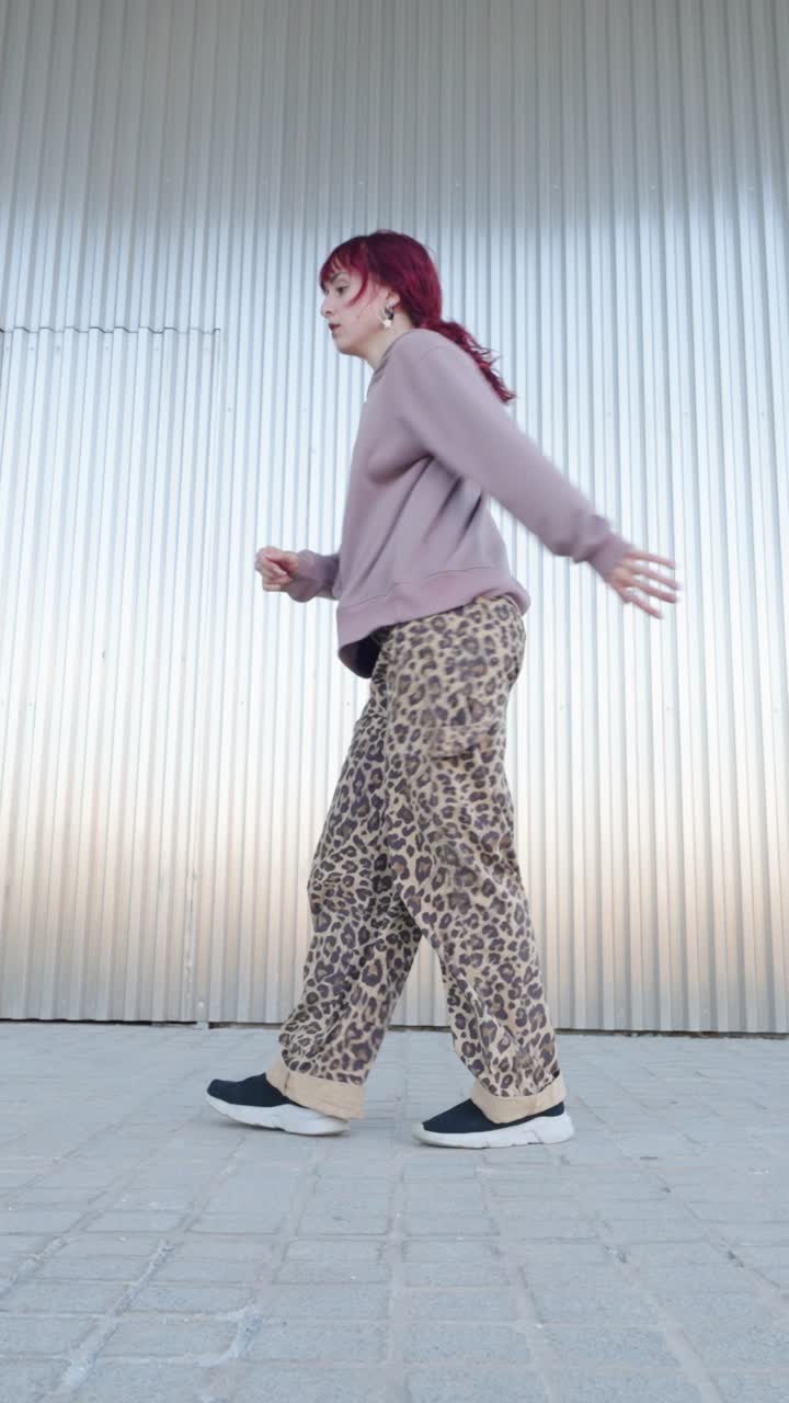 Young urban dancer performing energetic street dance routine