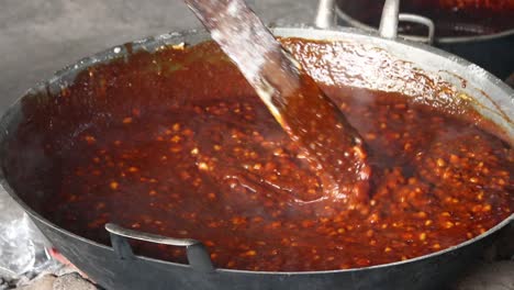 blurred video out of focus and noise video, traditional food artisans when processing various kinds of ingredients to make candil porridge