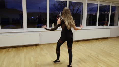 professional and passionate female dancer dances on the dance floor slow motion