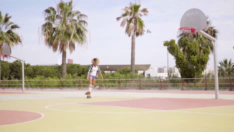 Sporty-young-woman-enjoying-herself-roller-skating