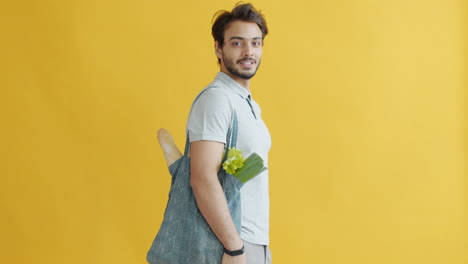 man with grocery bag