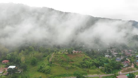 village in the valley with fog