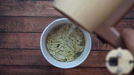 instant noodles being prepared