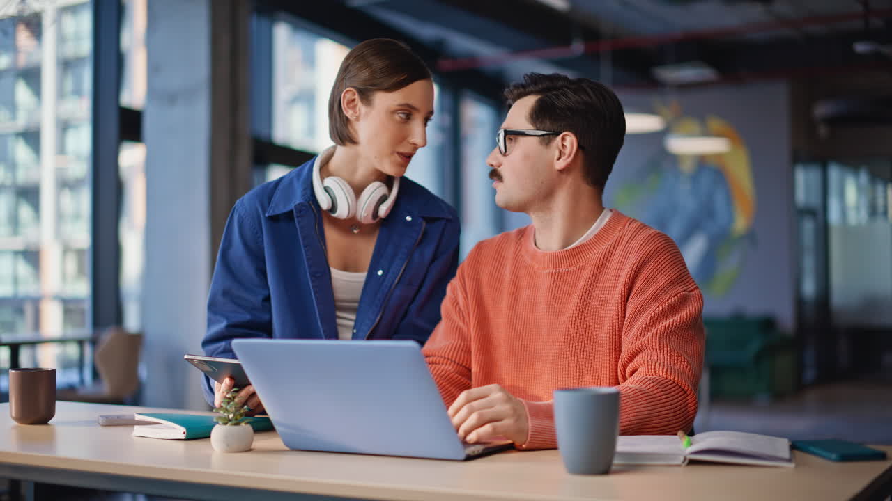 Company staff looking laptop screen collaborating on online project closeup