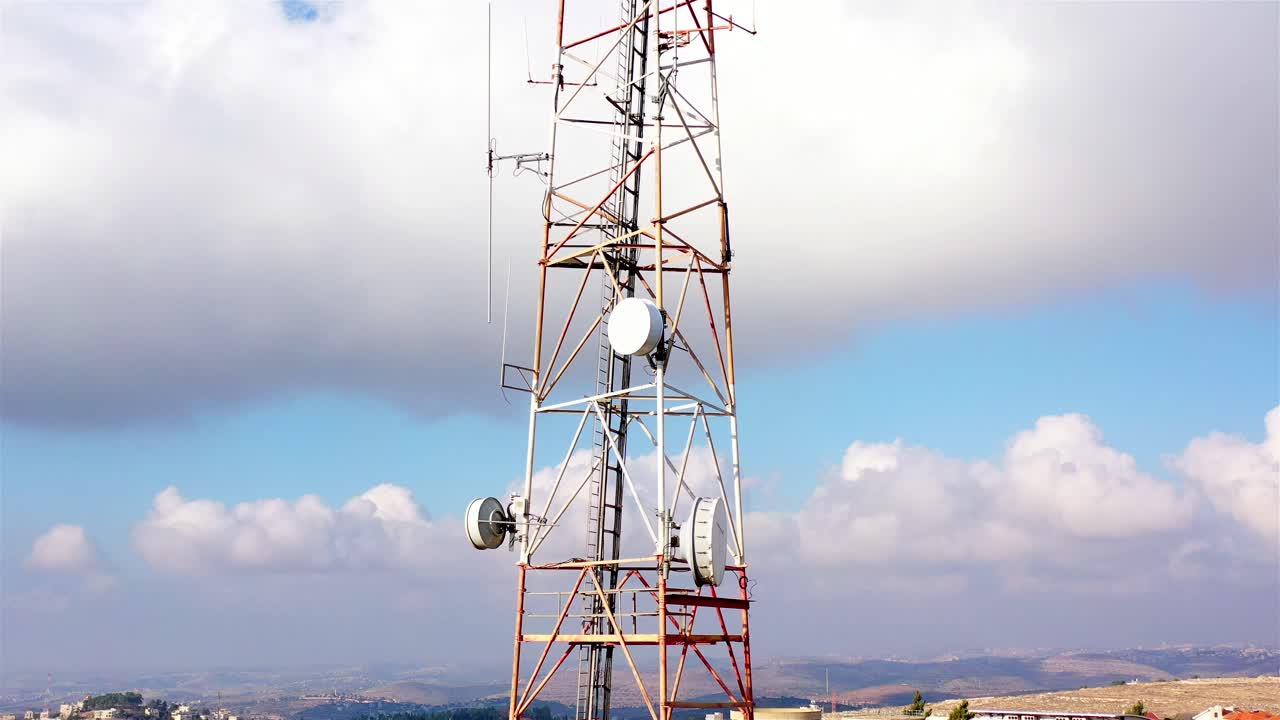Telecommunications Tower Against a Cloudy Sky