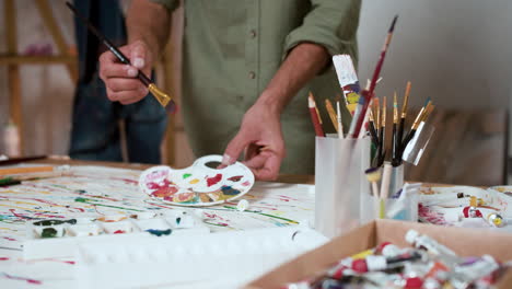 man painting on a paper