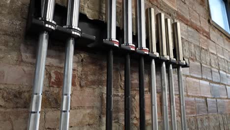 barbells lined up at gym