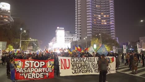 romanian people protest against mandatory vaccination, segregation on the street.